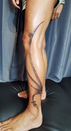 a person with a tattoo on their leg