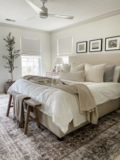 a bedroom with a large bed and wicker baskets on the floor