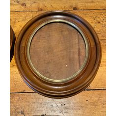 a wooden table with a metal ring on it