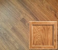 a wood floor with a square wooden frame on the top and bottom part of it