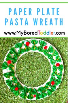 a paper plate wreath on the grass with text overlay