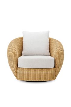 a wicker chair with a white pillow on the back and seat cushion in front of it