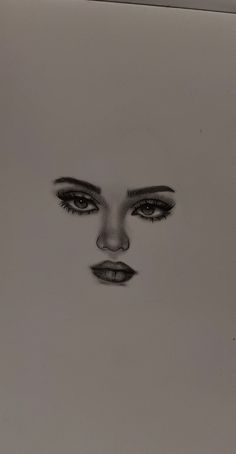 a black and white drawing of a woman's face with her eyes wide open