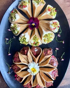 there are several different types of food on the plate, one is filled with flowers