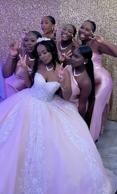 the bride and her bridal party posing for a photo