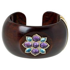 Rarities Gold-Plated Multigemstone Wood Cuff  This unique mixed media wood cuff sparkles with amethyst and blue topaz gemstones in a floral design. The hinged construction and natural elements make it the perfect addition to your Rarities collection.       S/M approx. 7"L x 1-13/16"W     M/L approx. 7-1/2"L x 1-13/16"W     Stamped .925 sterling silver; gold plating   Stone Information       All sizes and weights approximate     Total Carat Weight: 16.02ct (S/M) or 16.28ct (M/L)     Amethyst - Oval, round     Swiss Blue Topaz - Oval     White Zircon - Round Color Bands, Gold Bracelet Cuff, Swiss Blue Topaz, Rarity, Topaz Gemstone, Blue Topaz, Cuff Bracelet, Topaz, Jewelry Collection