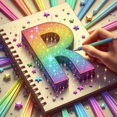 someone is drawing the letter p on a notebook with colored pencils and stars around it