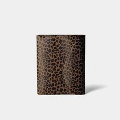 a brown and black leopard print wallet