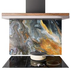 a stove top oven sitting next to a wall covered in colorful marbles and wood