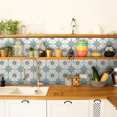 the kitchen counter is full of dishes and utensils