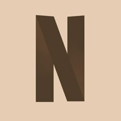 the letter n is made up of dark brown paper and has a shadow on it