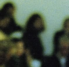 blurry image of several people standing together