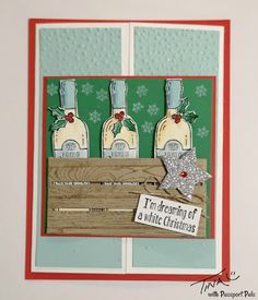 a christmas card with three bottles of wine in a crate and a star on the front