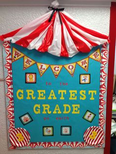 a bulletin board that says to the greatest grade on earth with circus tents and flags