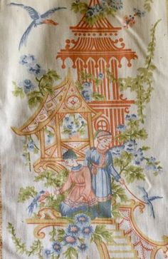 an embroidered piece of cloth with a woman and child in front of a birdcage