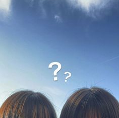 two women looking up at the sky with question marks above them on their heads,