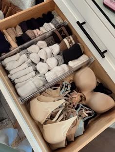 an organized drawer with shoes and bras