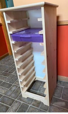 a wooden shelf with several shelves on it