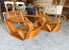 four wicker chairs are stacked on top of each other in a room filled with furniture