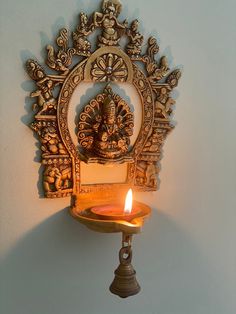 "This is Superfine 100% brass Laxmi Diya with Prabhavli, Home decor', Housewarming gift, & Wedding gift Dimensions: Height: 11 inches, Width: 7, Length : 4 inches, & Weight: 3.30 LB Approx. Package Contains: 1 Unit Of Wick wall hanging Lamp with Prabhavali Care: Do not clean with harsh chemicals Ships immediately via UPS/USPS/FedEx Light symbolizes knowledge, darkness, and ignorance. Lord is the \"Knowledge Principle\" (Chaitanya), who is the source, enlivener, and illuminator of all kno Prabhavali Frame, Wall Hanging Lamp, Diya Lamp, Antique Wall Decor, India Home Decor, Temple Design For Home, Handmade Lamp, Pooja Room Door Design, Pooja Room Design