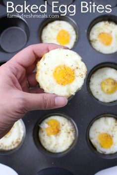 someone holding an egg in a muffin tin