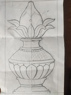 a drawing of a vase sitting on top of a table next to a piece of paper