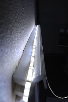 the light is shining down on the wall