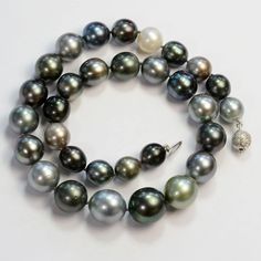 "Thank you for coming in! A spectacular necklace with extraordinary big Tahitian South Sea baroque pearl! The pearls have awesome size,  and extremely fine satin like luster and green/red 'peacock' iridescence! 31 pearls and 14k solid white gold diamondclasp, 17.5\" total length!  You'll get the pearls you see in the picture!  SIZE: appx: 11.2mmx11.5mm-15.8mmx16.8mm GRADE: Smooth Satin-Like Surface COLOR: Grey with Green/Red Iridescence" Red Peacock, Bead Tips, Baroque Pearl Necklace, South Seas, Diamond Gold, Shell Beads, Pearl Chain, Picture Size, Tahiti