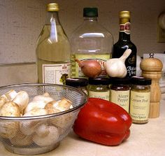 the ingredients are on the counter ready to be used in this recipe, including mushrooms, tomatoes and garlic