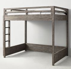 a wooden bunk bed sitting next to a white wall