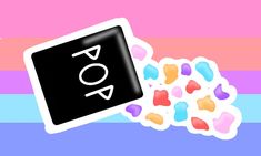 a sticker with the word pop on it next to candy hearts and a rainbow striped background