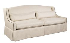 a white couch with two pillows on it