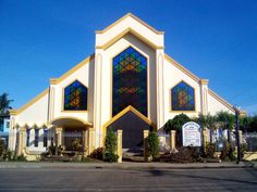 a large church with stained glass windows on the front