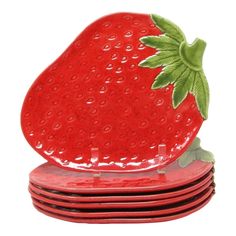 strawberry shaped plates stacked on top of each other