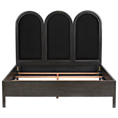 an upholstered bed frame with four arched headboards and foot boards in black