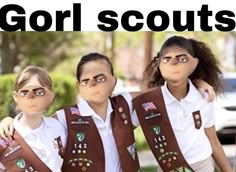 three girls wearing scout uniforms with the words gorl scouts