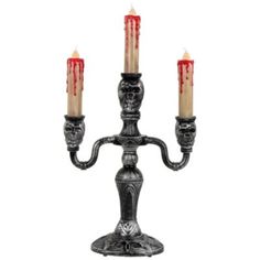 a candle holder with three candles in it