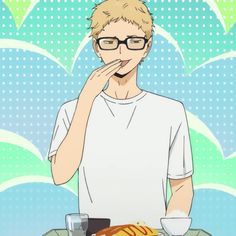 a man with glasses is looking at food on the table and he has his hand to his mouth