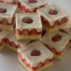 there are many pieces of cake with strawberries on them