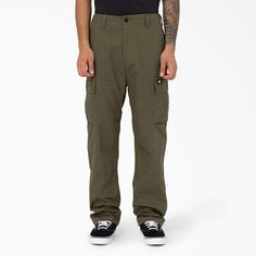 The Eagle Bend is a traditional relaxed cargo pant with iconic Dickies style and detailing. Featuring two side cargo pockets with hidden snap closure, reinforcement at the knee and saddle patch and hem adjusters on the cuff. Made of heavy ripstop cotton. A timeless utility pant that’s made for everyday wear and built to last. Utility Cargo Pants With Hip Pockets For Outdoor, Utility Cargo Pants With Hip Pockets For Outdoor Activities, Full Length Cargo Pants With Patch Pockets For Outdoor, Outdoor Full Length Cargo Pants With Patch Pockets, Outdoor Full-length Cargo Pants With Patch Pockets, Military Style Work Pants With Cargo Pockets, Military Style Pants With Patch Pockets For Outdoor, Military Pants With Patch Pockets For Outdoor, Military Pants With Patch Pockets For Outdoor Activities