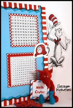 the cat in the hat themed bulletin board is next to a red teddy bear and a blue frame