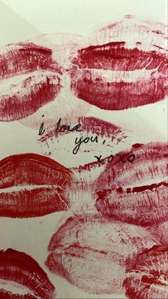 a close up of lipstick on a piece of paper with words written in the middle