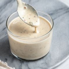 a spoon is in a small glass bowl