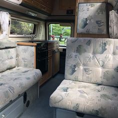 the interior of an rv with two couches