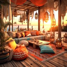 an outdoor seating area with lots of pillows and lights on the ceiling, overlooking the ocean