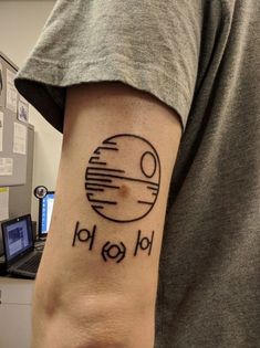 a man with a tattoo on his arm that reads, star wars 10109