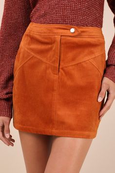 The Lulus Perfected Cuteness Rust Orange Corduroy High-Rise Mini Skirt was made to be paired with chunky sweaters and sleek knee-high boots! Soft ribbed corduroy shapes this trendy skirt that features a high, banded waist with a snap button strap and a hidden zip fly. The A-line silhouette features vintage-inspired, yoke seam detailing across the front, decorative welt pockets at the back, and a flirty mini hem. Fit: This garment fits true to size. Length: Mid-thigh. Size medium measures 15.5" f Corduroy Mini Skirt For Work, Casual Corduroy Mini Skirt For Fall, Casual Fall Corduroy Mini Skirt, Corduroy Skirt For Fall Workwear, Fall Corduroy Skirt For Workwear, Fall Cotton Mini Skirt With Pockets, Fall Corduroy Skirt With Pockets, Trendy Winter Mini Skirt With Pockets, Fall Mini Length Bottoms