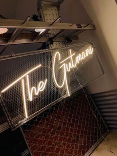 there is a neon sign that says the gutman's