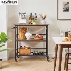 a shelf with wine bottles, bread and other items on it in a dining room