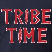 a t - shirt with the words tribe time written in red and white on it